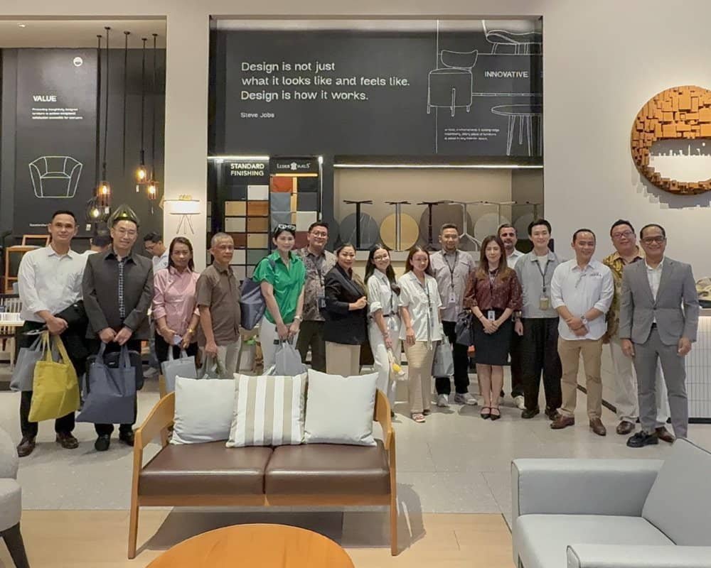 Group photo of all attendees gathered at the Ikons Furniture showroom during Summer Soirée 2025.